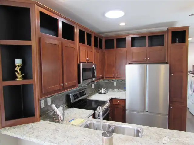 UNDER COUNTER LIGHTING AND TILE BACK SPLASH.