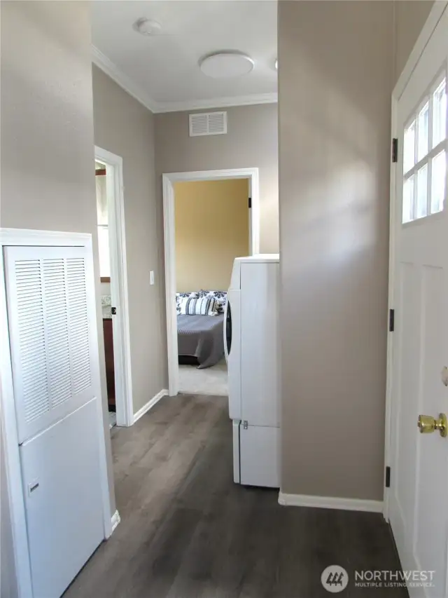 PRIMARY BEDROOM AT END OF HALL, BACK DOOR ON RIGHT. AND OTHER BATHROOM ON LEFT.