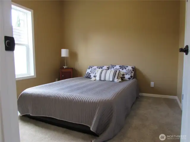 MASTER BEDROOM WITH CLOSET DOOR TO RIGHT.