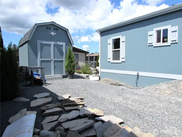 WALKWAY TO BACK PATIO ENTRANCE IS BEING INSTALLED NOW. SHED HAS POWER, LOFT & DOUBLE DOOR ENTRY. LOT IS DESIGNED FOR LOW MAINTAINCE.