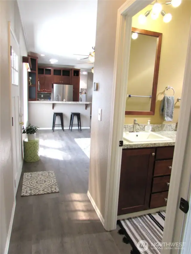 FRONT DOOR ON LEFT AND MAIN BATH ON RIGHT.