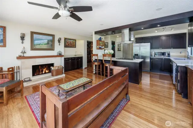 A wonderful gathering space, open to kitchen, wet bar, fireplace and to the newly built wood deck and private backyard.