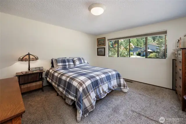 Primary suite has updated 3/4 bath and cedar lined walk in closet.