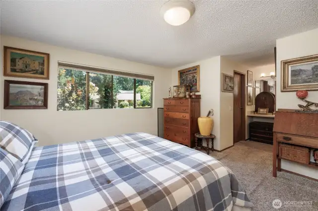 Primary suite has updated 3/4 bath and cedar lined walk in closet.
