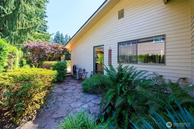 Side yard with stone pavers.