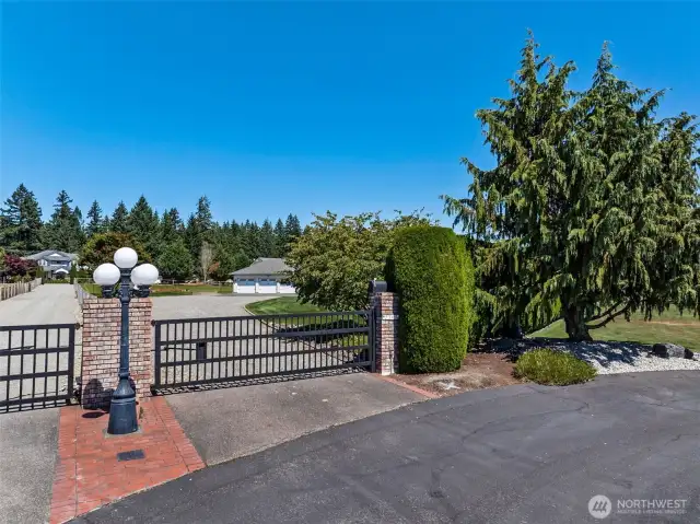 Double gated.  Gate at the entrance of the community and a gate at the residence.