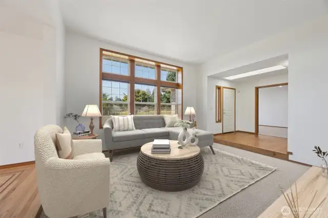 Huge picture windows in the living room. Virtually staged