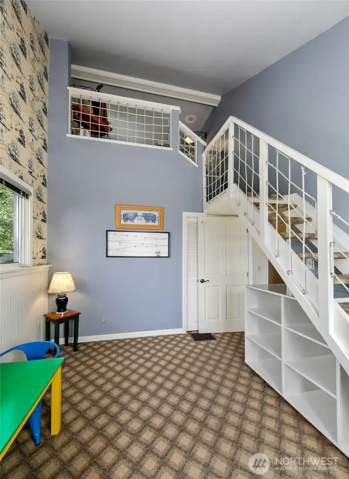 Another view of the 3rd bedroom on the main floor and look up.....See the loft and play area.  There is also great attic space for decorations, luggage and more.