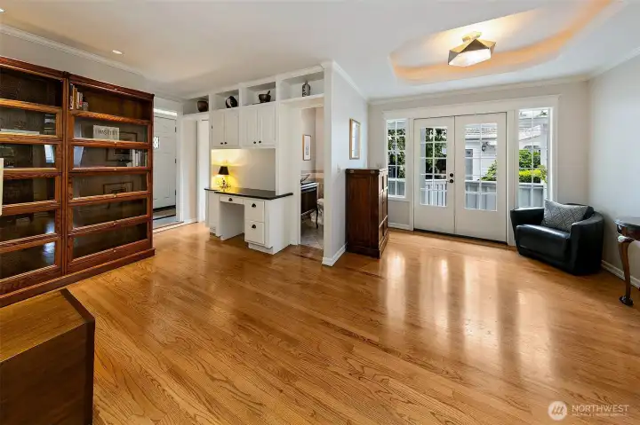Sitting room off the entry area.  Built-in deck if wanted.  There is a half bathroom here for guests.