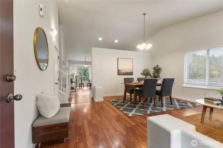 As you enter your home, you are greeted by a formal living/dining area with vaulted ceilings.