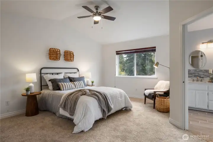 Welcome to your spacious primary retreat! Plush new carpet and an updated bathroom are waiting for you.