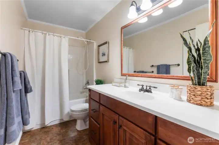 This is the upstairs full bathroom, with plenty of counter and cabinet space for everyone.