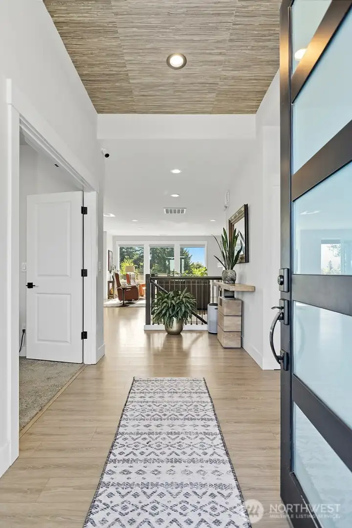 Upon entering the home you walk down a short hallway to access the main floor.