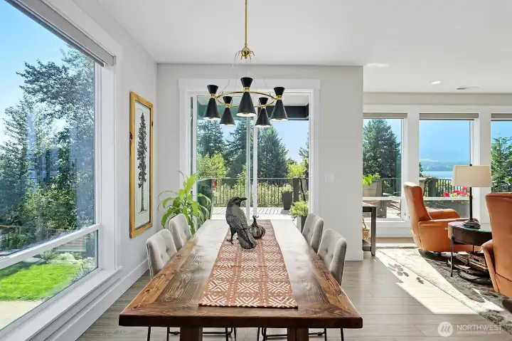 Dining area off the kitchen and adjacent to the Great Room.  Amazing views of the river and mountains from all windows.