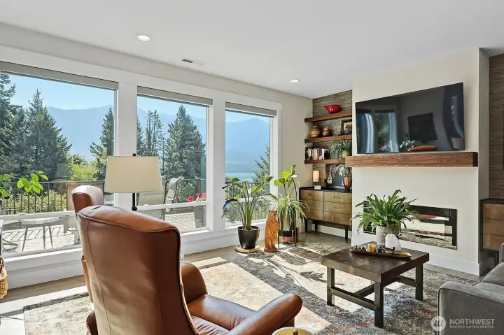 Great room with access to fireplace, television and amazing views of the River and Mountains!