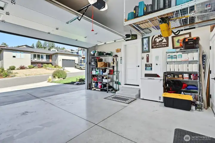 Spacious garage with amazing storage racks added to fit all of your belongings and toys.