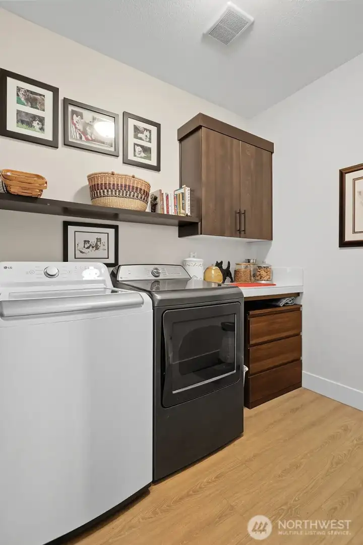 Laundry room with room for additional storage.