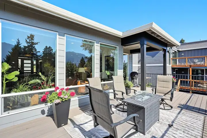 Beautiful back upper deck perfect for enjoying the sunshine and taking in the beautiful views.
