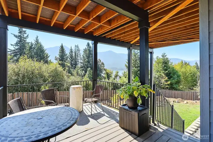 View of the lower back deck for enjoying the views.  This deck also allows easy access to the fenced back yard.