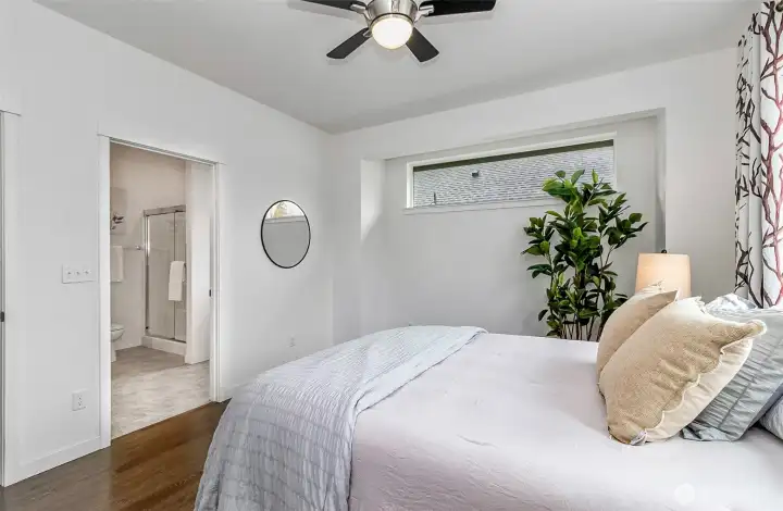 Main suite leading into ensuite bathroom directly attached to bedroom