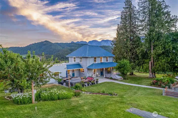 The Ultimate Guest Amenity: Soak in the private hot tub under the stars. The 1.4-acre grounds feature lavender-ready soil and plenty of room for boutique agro-tourism or a private estate garden.