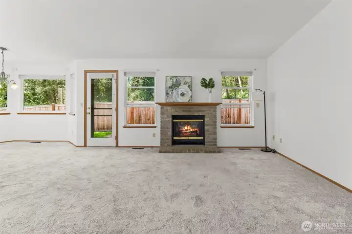 Living room centers around the gas fireplace for setting the scene and chasing the chill i