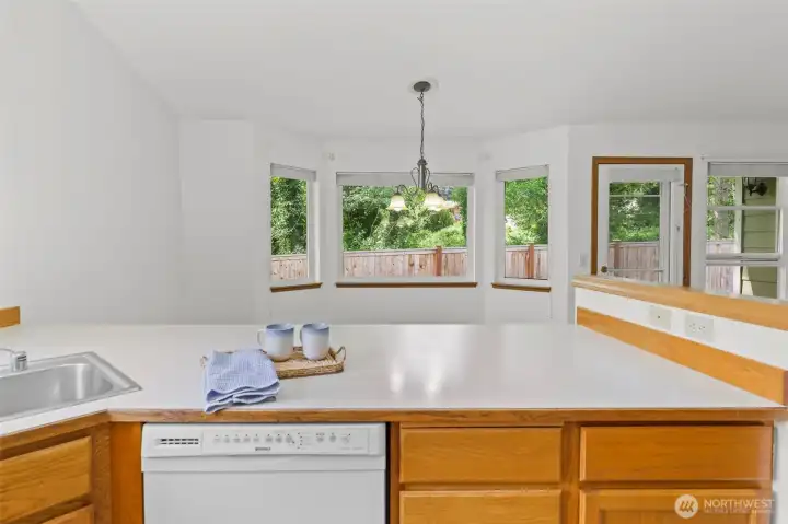 Bright kitchen with a welcoming greenspace view
