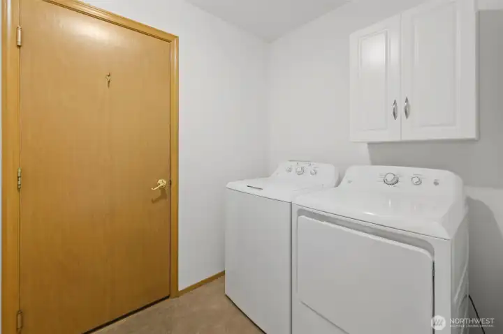 Conveniently just off the living space, your laundry room with full-size machines included, leads to your garage