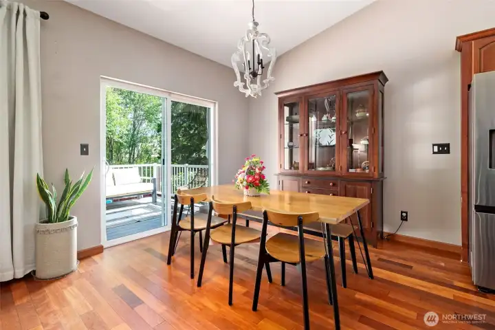 Dining room with sliding glass doors to the back deck. Dining room with sliding glass doors to the back deck.