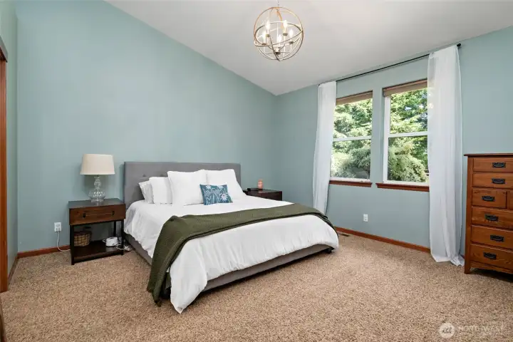 Primary bedroom with vaulted ceiling. Primary bedroom with vaulted ceiling.