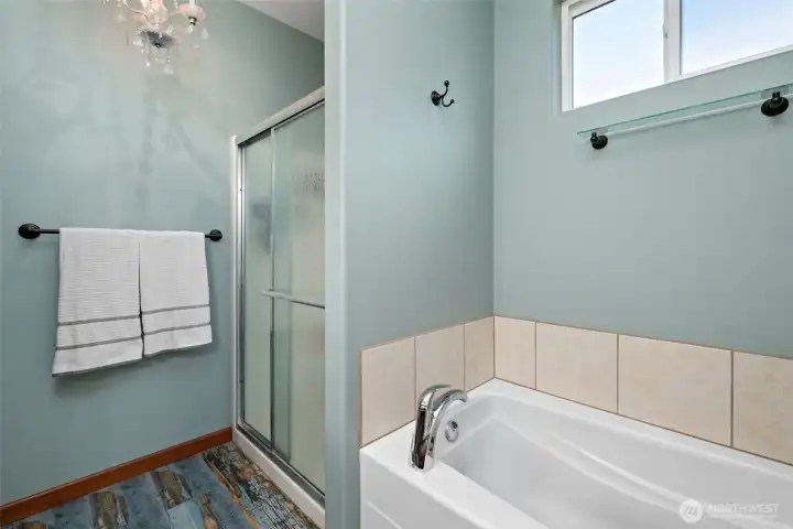 Five piece primary bathroom includes a soaking tub. Five piece primary bathroom includes a soaking tub.
