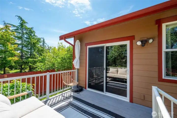 Back deck with sliding door into dining room. Back deck with sliding door into dining room.