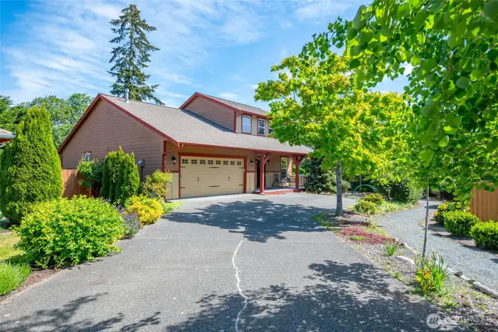 Tree lined driveway into your two car garage. Tree lined driveway into your two car garage.