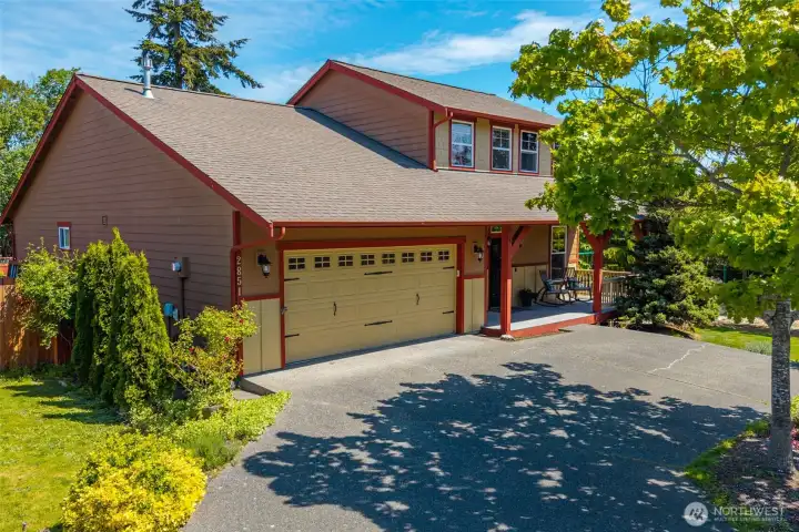 Attached two car garage and peaceful front porch. Attached two car garage and peaceful front porch.