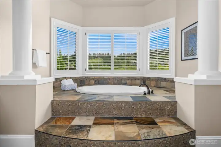 Owner Suite jetted tub with private golf course views Owner Suite jetted tub with private golf course views