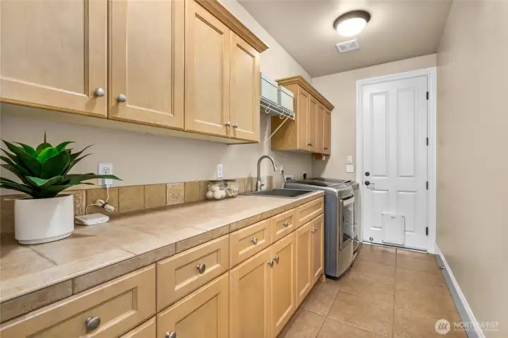 Laundry room with lots of storage and sink Laundry room with lots of storage and sink