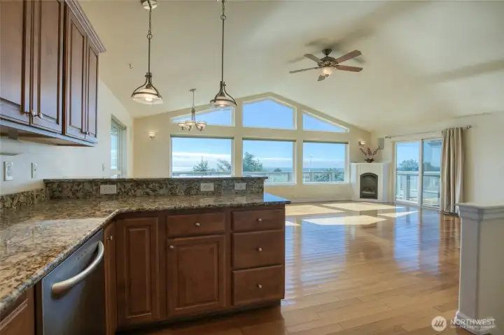 The kitchen is located so the cook can participate in all of the activities. It has stainless appliances and granite counters.