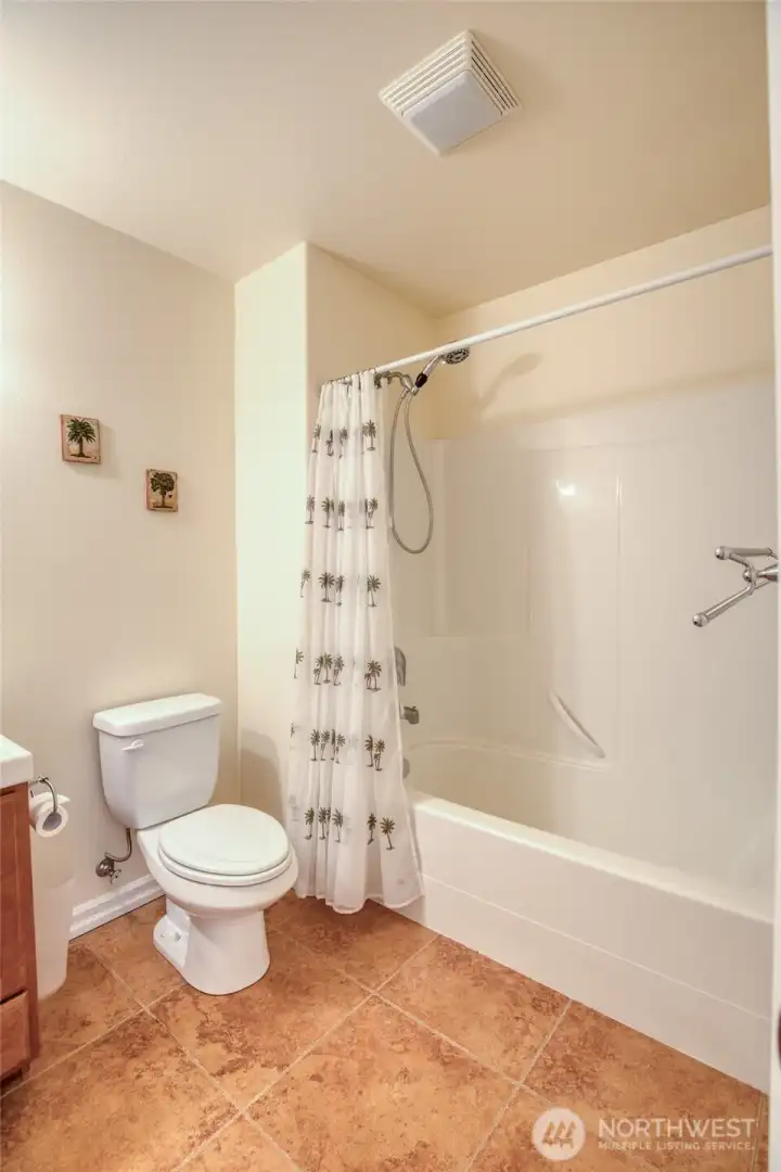...with a tub shower and tiled flooring.