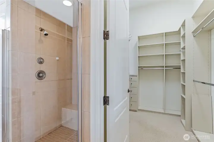 Walk through primary closet with organizers. Walk through primary closet with organizers.