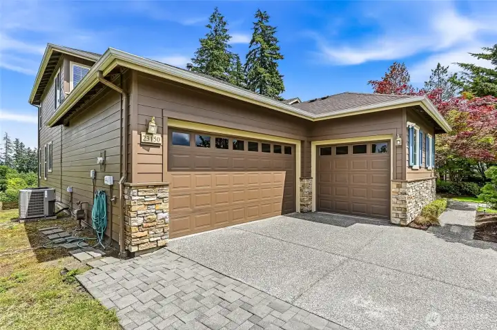 Two car garage plus 3rd bay perfect for workshop, golf cart, storage. Two car garage plus 3rd bay perfect for workshop, golf cart, storage.