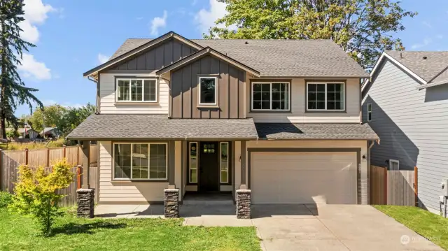 Built in 2020 this home shows the beautiful rock details and the front covered patio & entry.