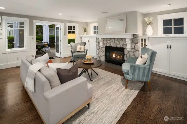 Great room with built-ins and gorgeous fireplace with salvaged wood mantle.