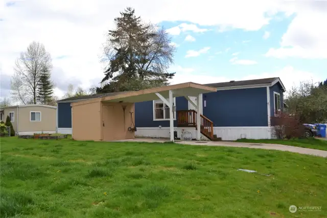 The storage shed and carport provide extra space for your belongings.