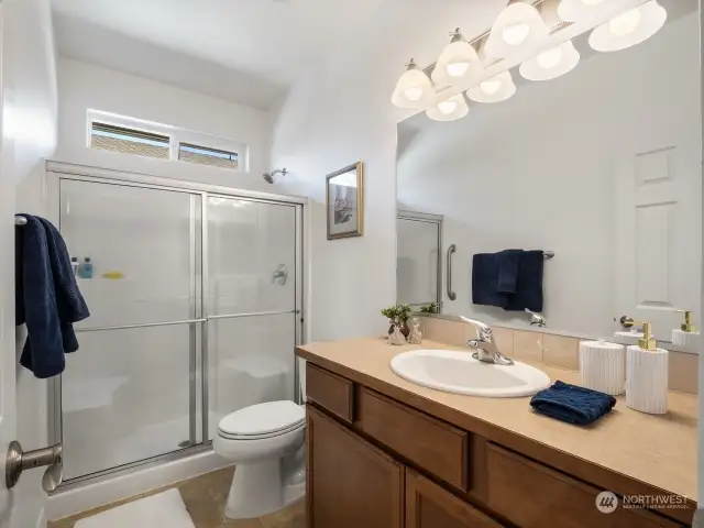 The primary bath has a large walk in shower that makes getting ready in the morning a joy.