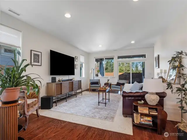 The generously sized family room welcomes you in to this bright and sunny home.