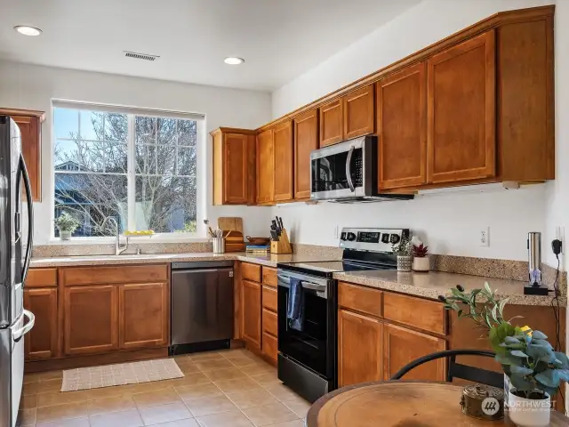 The kitchen has room for more than one cook to work at the same time. Lots of storage and counter space.