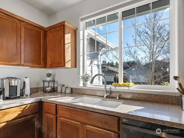 The easy to clean granite countertops gives a nice contrast to the wood cabinets.