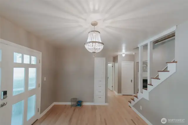 the entry space with built ins and two closets