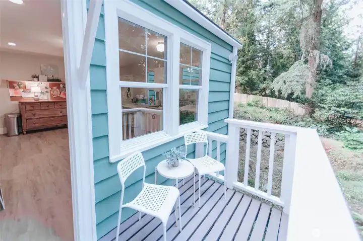 fun outdoor deck off of the laundry and main living space perfect for sipping a cup of coffee or tea or perhaps a glass of wine while listening to the birds sing