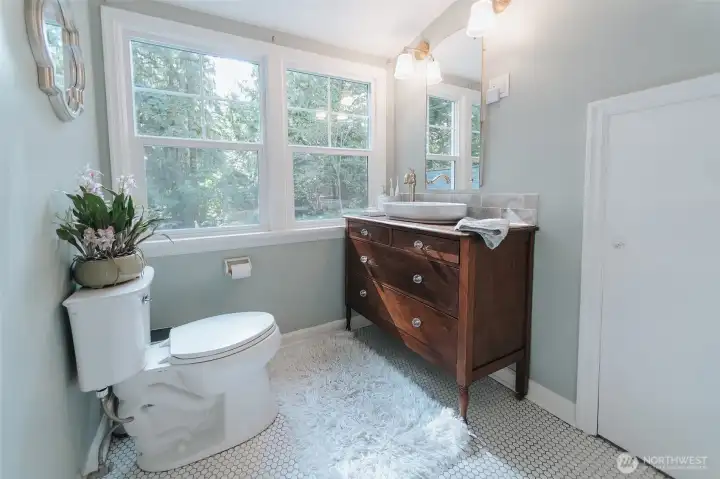 light filled upper floor 3/4 bath. the brand new shower is hiding because bathrooms are just hard to get everything into the picture  but it is beautiful with white tile and gold shower